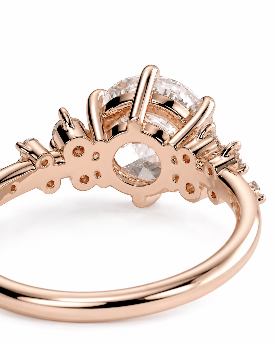 color_10K_RG, color_14K_RG &&Rose gold ring with a large round clear center stone and smaller side stones, shown in a close-up studio shot on a white background.