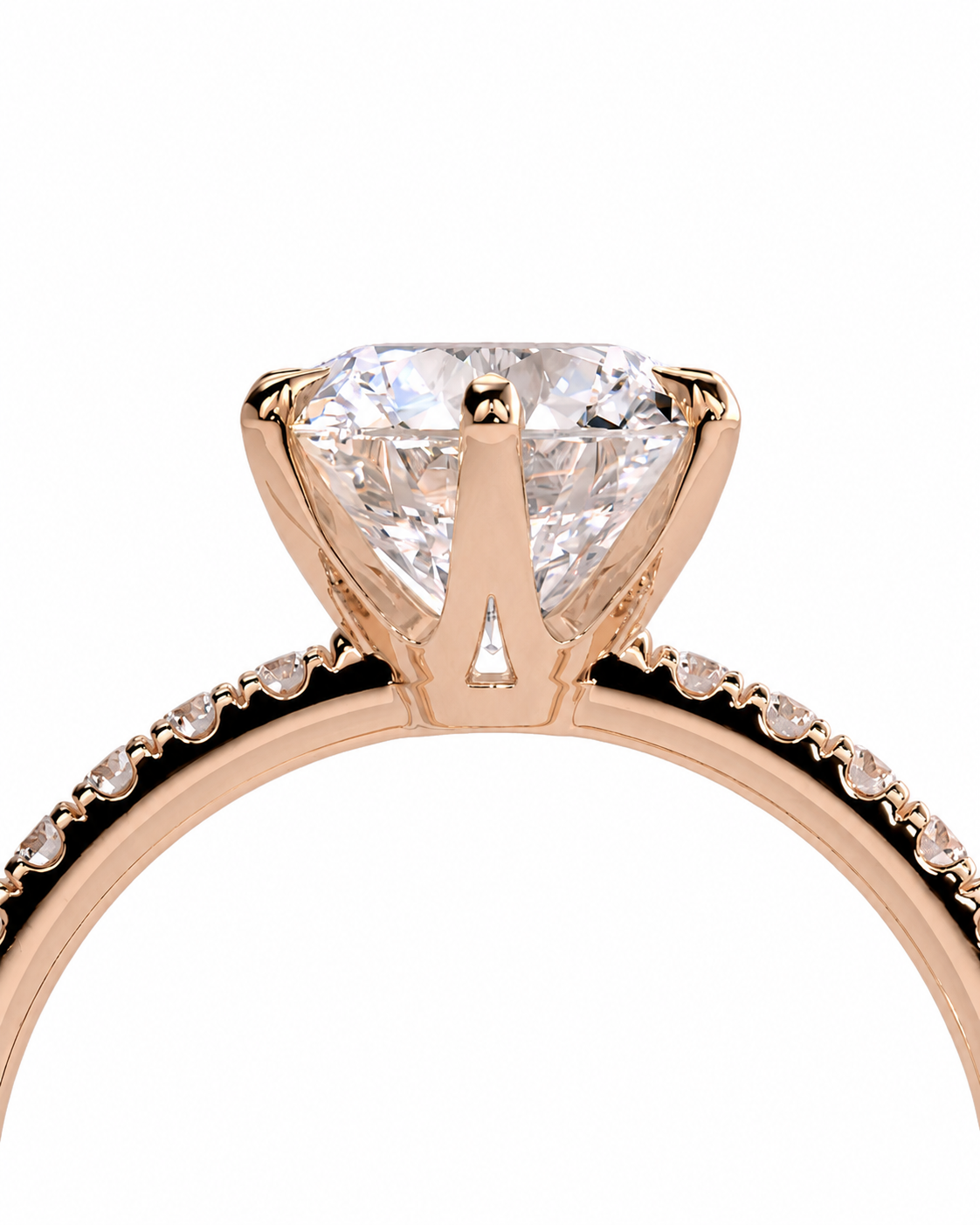 color_10K_RG, color_14K_RG &&A close-up of a rose gold engagement ring featuring a large round brilliant-cut diamond center stone in a four-prong setting, with a pavé band of small round diamonds on a white background.