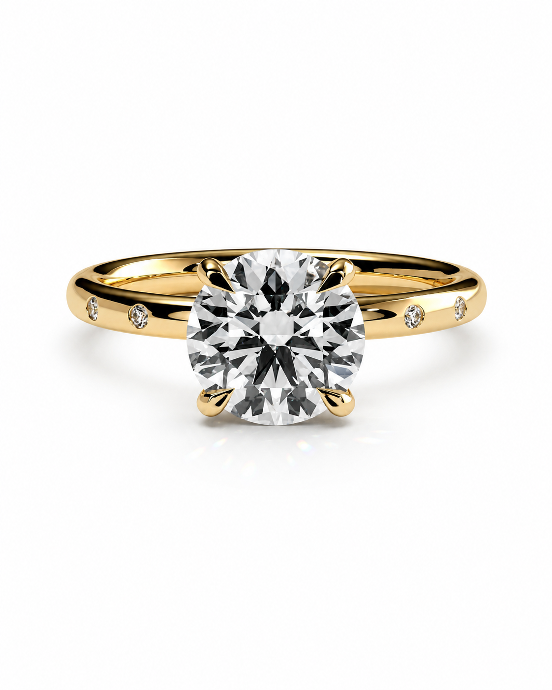 color_10K_YG, color_14K_YG &&A yellow gold solitaire engagement ring with a round brilliant-cut diamond center stone and small accent diamonds on the band, set against a clean white background.