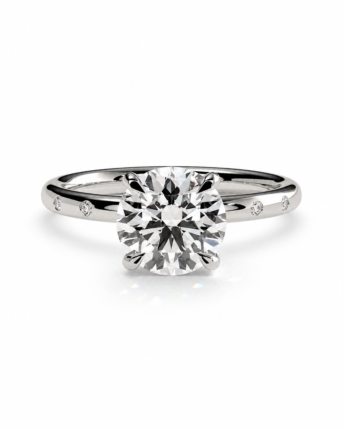 color_925_SIL,color_935_ARG,color_10K_WG, color_14K_WG &&A classic solitaire engagement ring featuring a round brilliant-cut diamond set in a polished silver-colored metal band with small accent diamonds on the shoulders, shown on a clean white background.