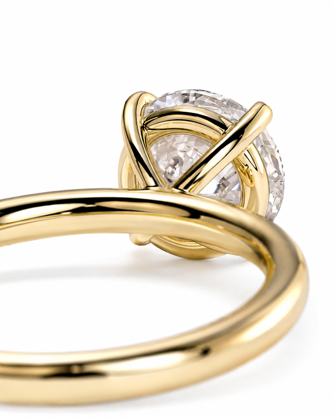 color_10K_YG, color_14K_YG &&A close-up of a gold ring featuring a round clear gemstone in a unique twisted wrap setting, shown on a clean white background.