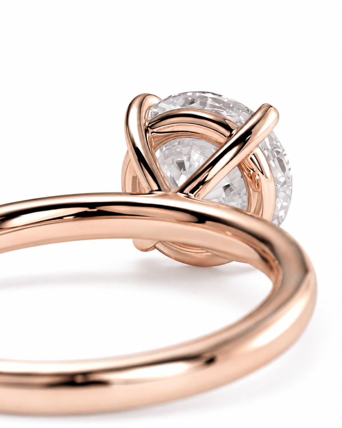 color_10K_RG, color_14K_RG &&Close-up of a rose gold ring with a round brilliant-cut diamond, showing the polished metal band and the diamond setting against a white background.