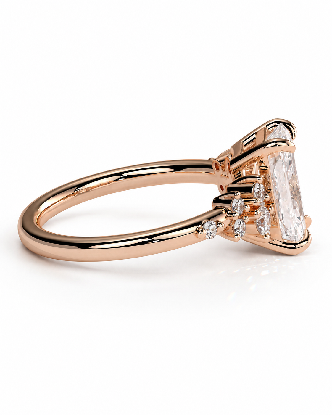 color_10K_RG, color_14K_RG &&A rose gold ring with a large rectangular clear gemstone and smaller accent stones, shown on a clean white background.