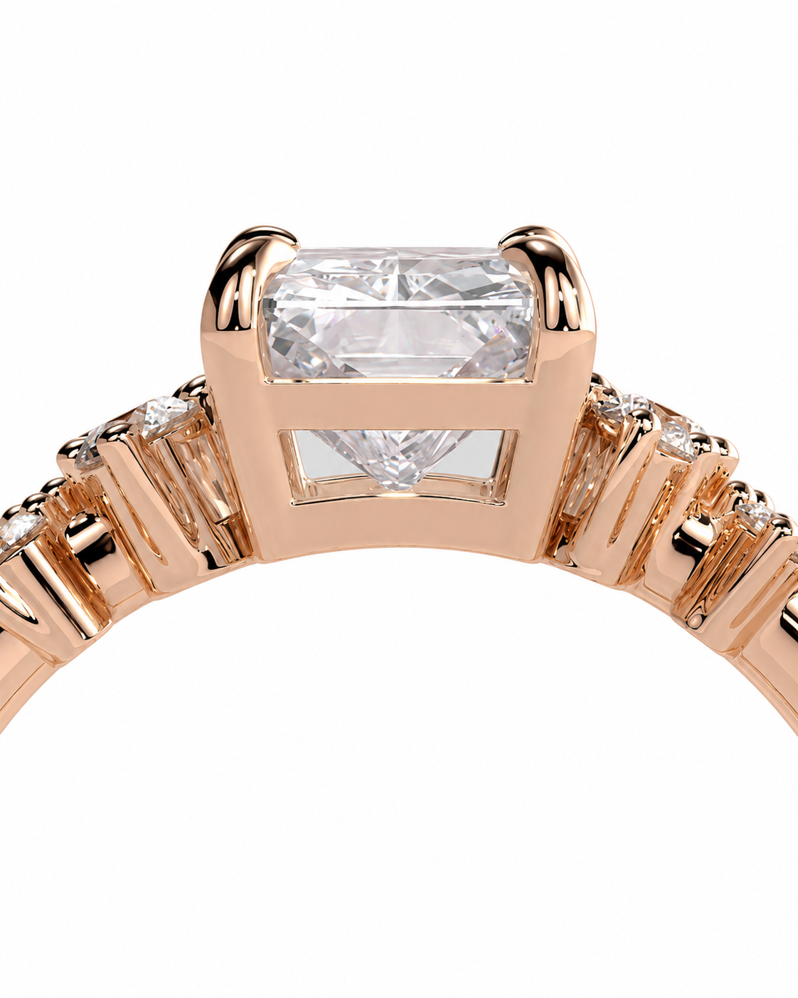 color_10K_RG, color_14K_RG &&Close-up of a rose gold ring featuring a rectangular clear center stone and smaller side stones on a white background.
