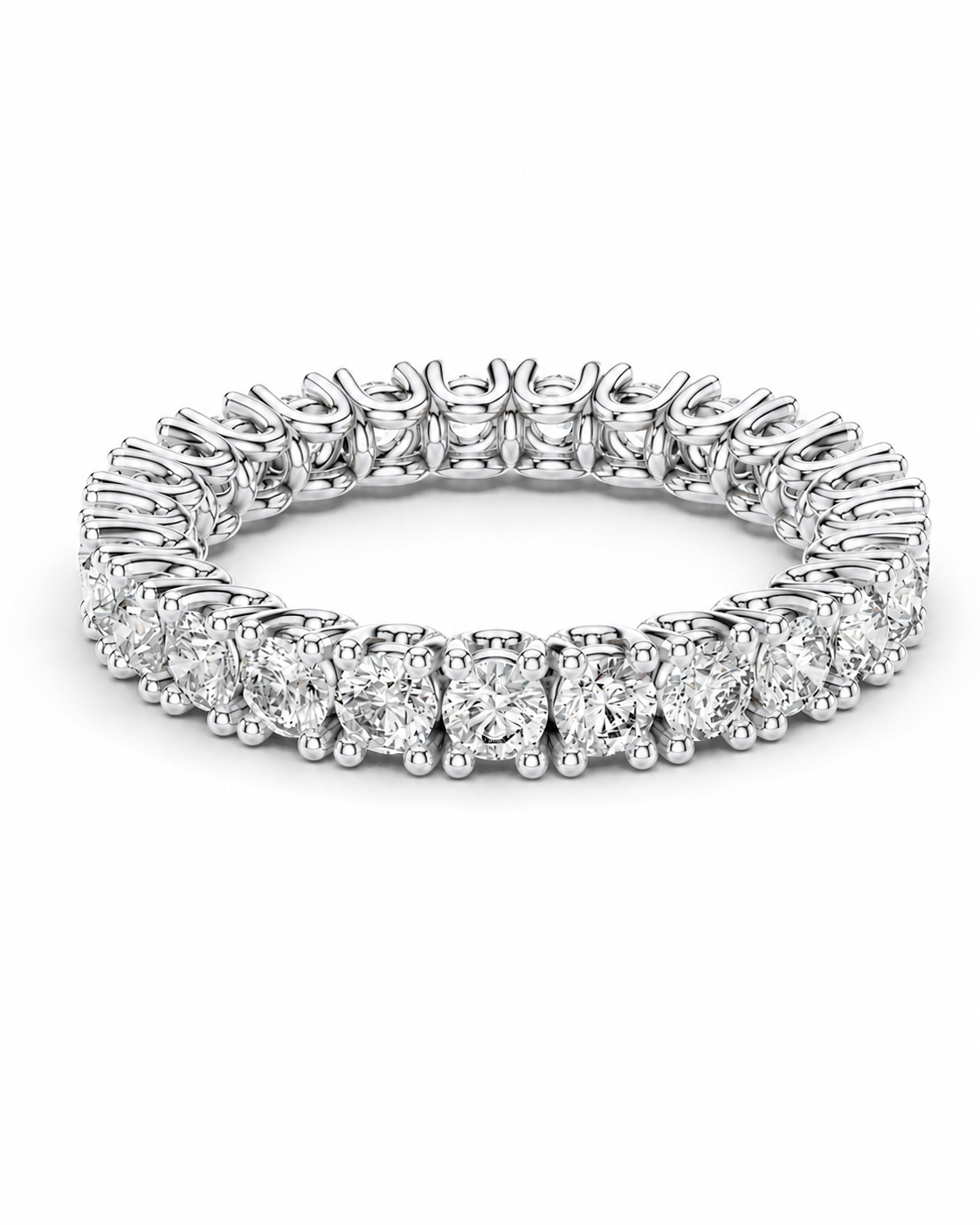 color_925_SIL,color_935_ARG,color_10K_WG, color_14K_WG &&A brilliant round-cut diamond eternity ring in a silver-toned metal setting, shown on a clean white background.
