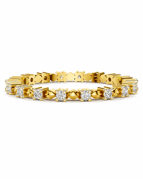 color_10K_YG, color_14K_YG &&A yellow gold tennis bracelet featuring round and baguette-cut clear gemstones in a classic prong setting, displayed against a solid white background.