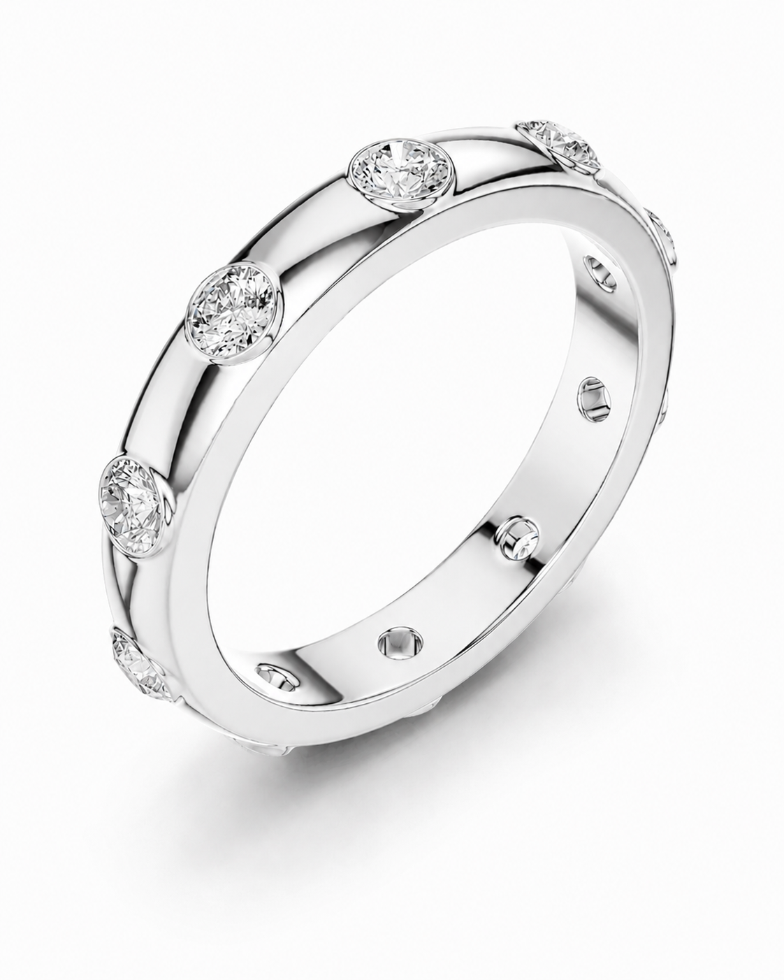 color_925_SIL,color_935_ARG,color_10K_WG, color_14K_WG &&A polished silver-tone band ring featuring evenly spaced round bezel-set clear gemstones, shown on a clean white background.