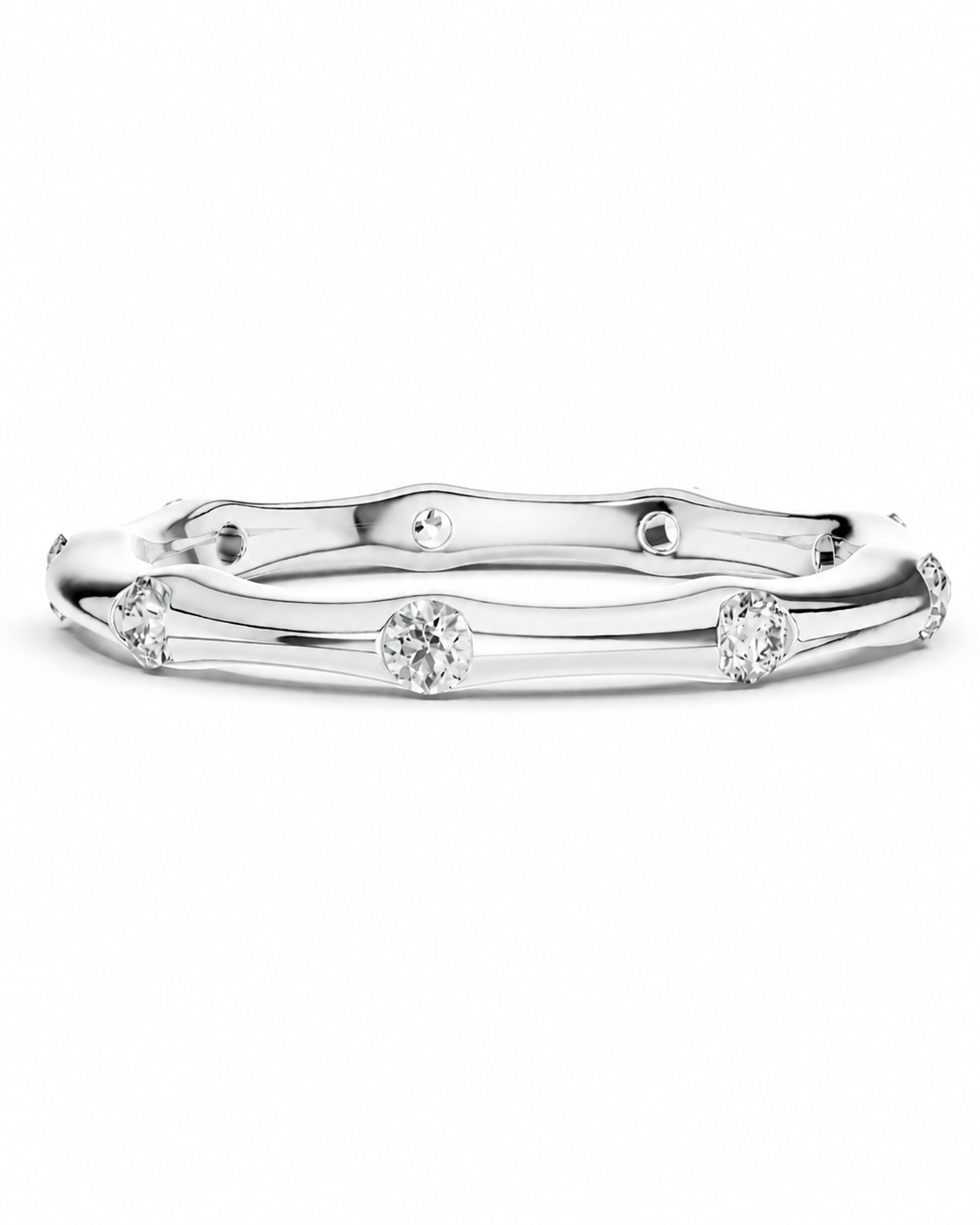 color_925_SIL,color_935_ARG,color_10K_WG, color_14K_WG &&A polished silver-tone band ring featuring a wavy, bamboo-inspired design with small round clear gemstones spaced along the front, set against a seamless white background.