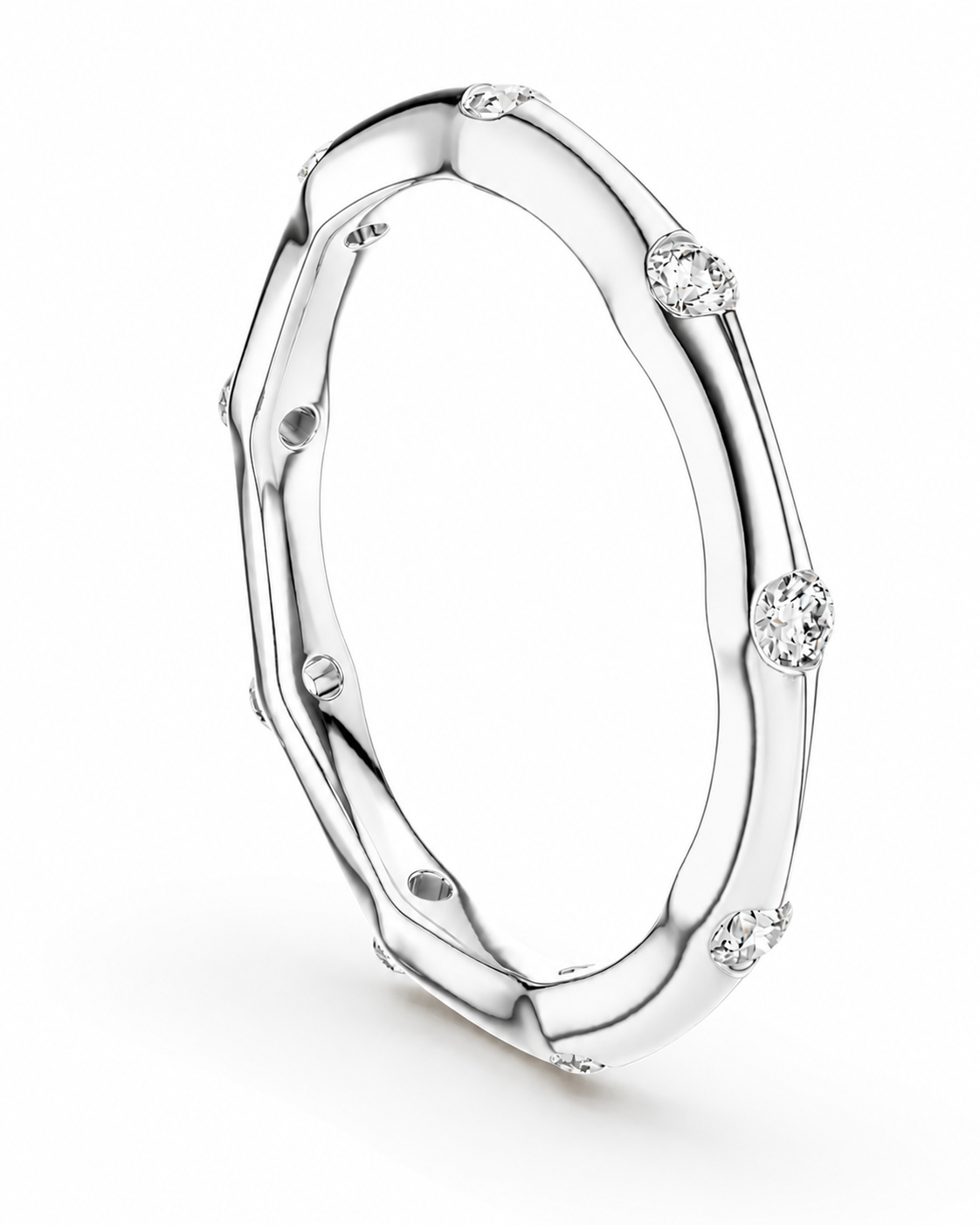 color_925_SIL,color_935_ARG,color_10K_WG, color_14K_WG &&A polished silver-toned band ring with a sculptural, organic wavy shape and several small round clear gemstones set along the outer edge, shown on a clean white background.