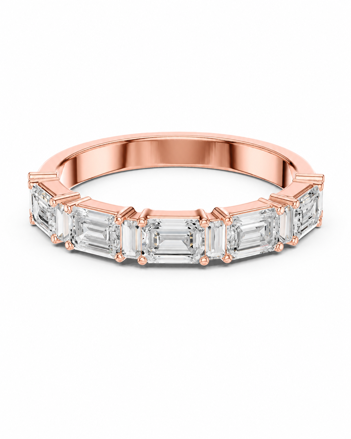 color_10K_RG, color_14K_RG &&A rose gold eternity ring featuring a row of baguette-cut clear gemstones in a prong setting, shown on a clean white background.