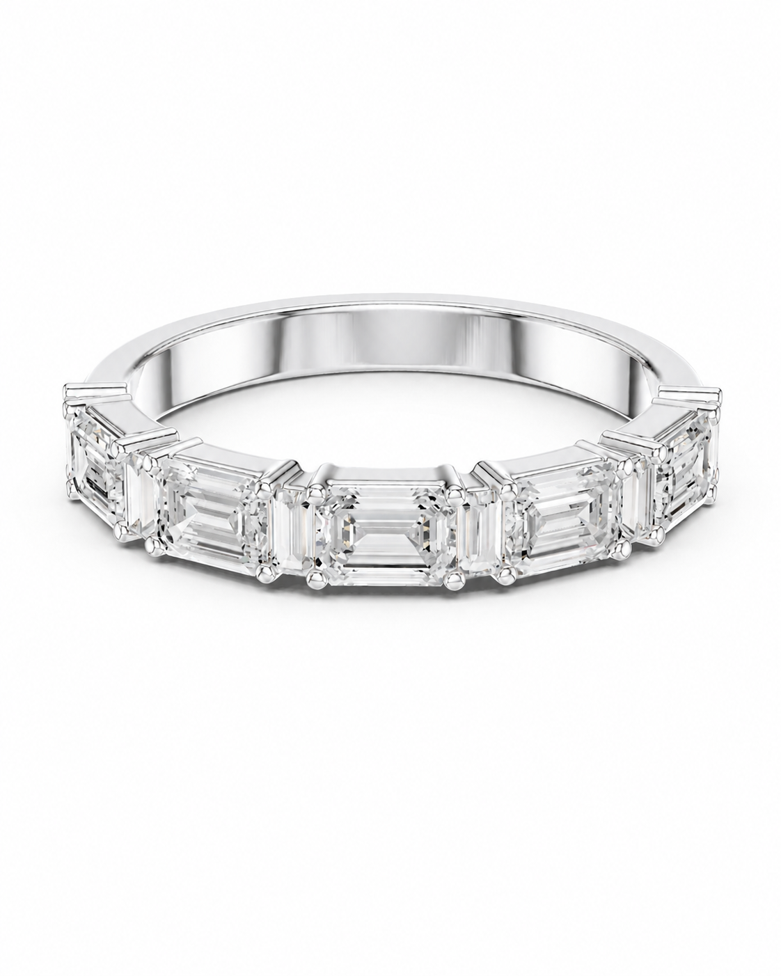 color_925_SIL,color_935_ARG,color_10K_WG, color_14K_WG &&A silver band ring featuring a row of baguette-cut clear gemstones in a prong setting, shown against a plain white background.