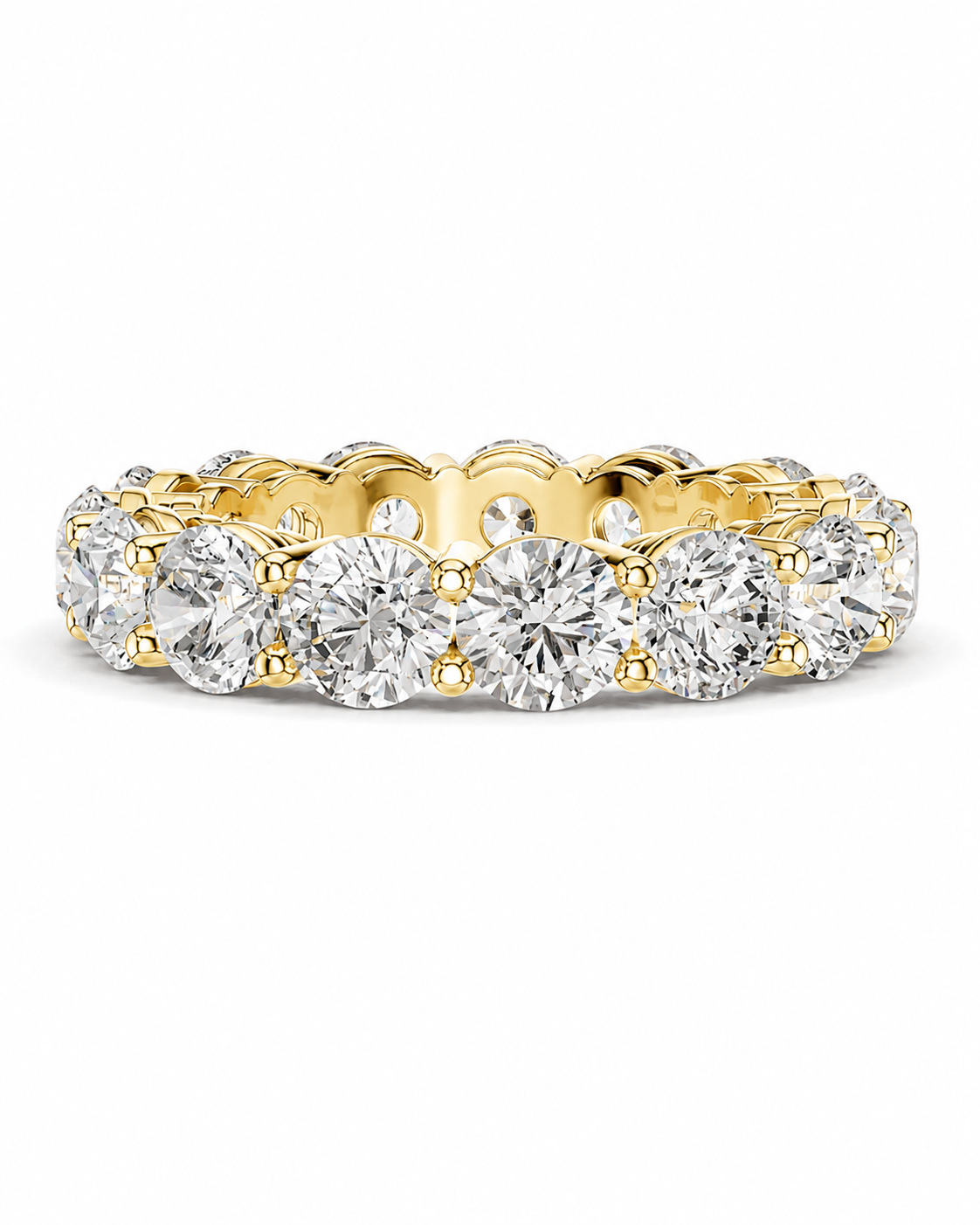 color_10K_YG, color_14K_YG &&A yellow gold eternity ring featuring a row of round brilliant-cut diamonds in a prong setting, shown against a plain white background.