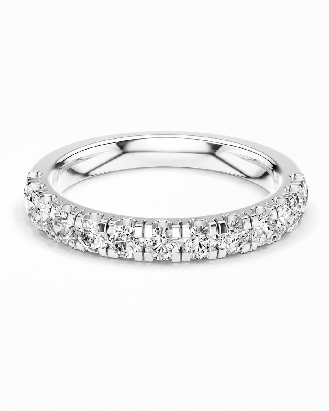 color_925_SIL,color_935_ARG,color_10K_WG, color_14K_WG &&A silver-tone diamond eternity ring with a continuous row of round-cut diamonds set in a prong setting, shown on a clean white background.