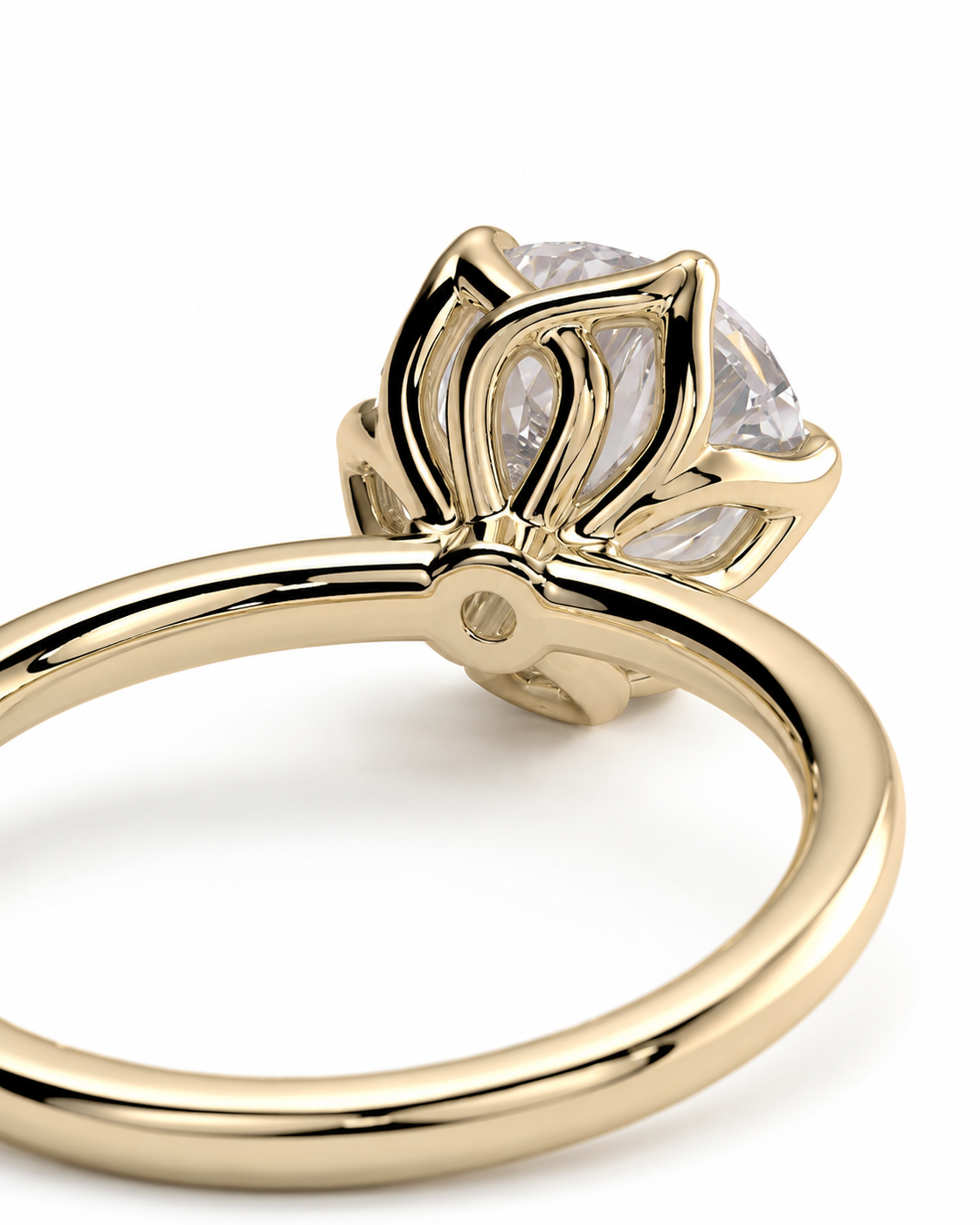 color_10K_YG, color_14K_YG &&A close-up shot of a yellow gold ring with a clear round-cut gemstone in a prong setting, shown on a plain white background.