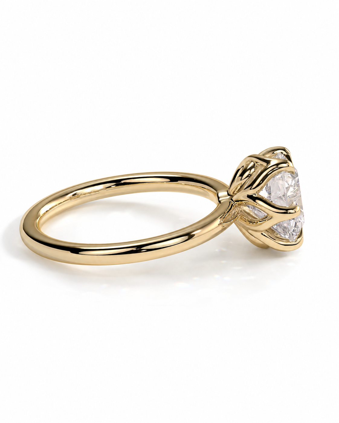 color_10K_YG, color_14K_YG &&A yellow gold ring with a three-stone diamond solitaire setting, shown from a side angle on a clean white background.