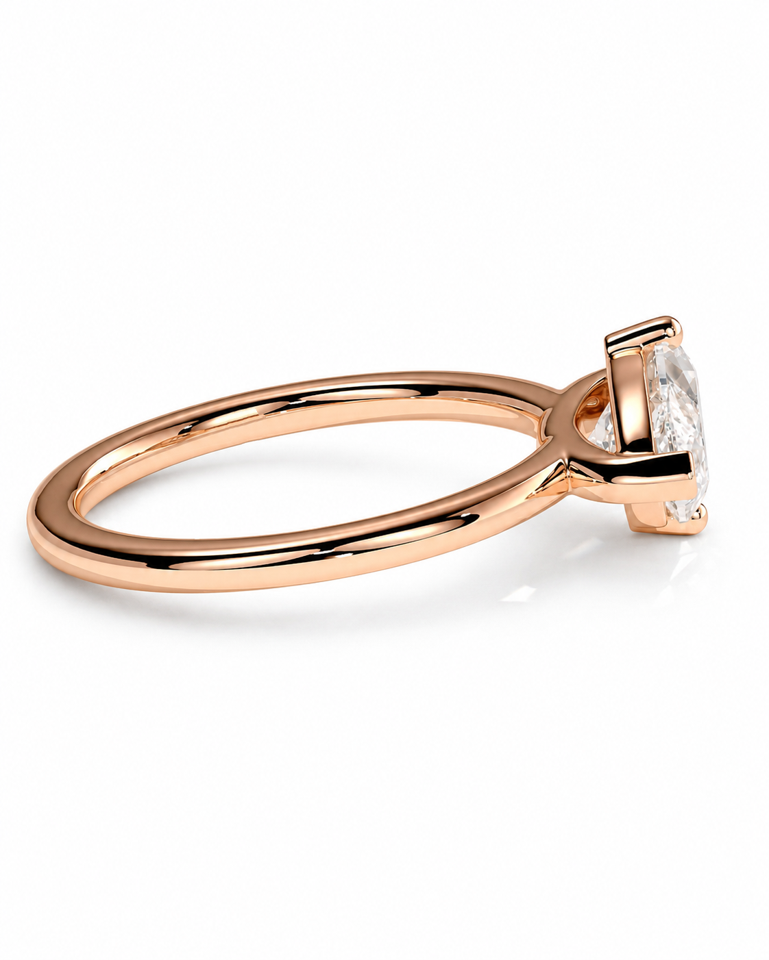 color_10K_RG, color_14K_RG &&A rose gold solitaire engagement ring with a clear marquise-cut gemstone, shown in a three-quarter side view on a clean white background.
