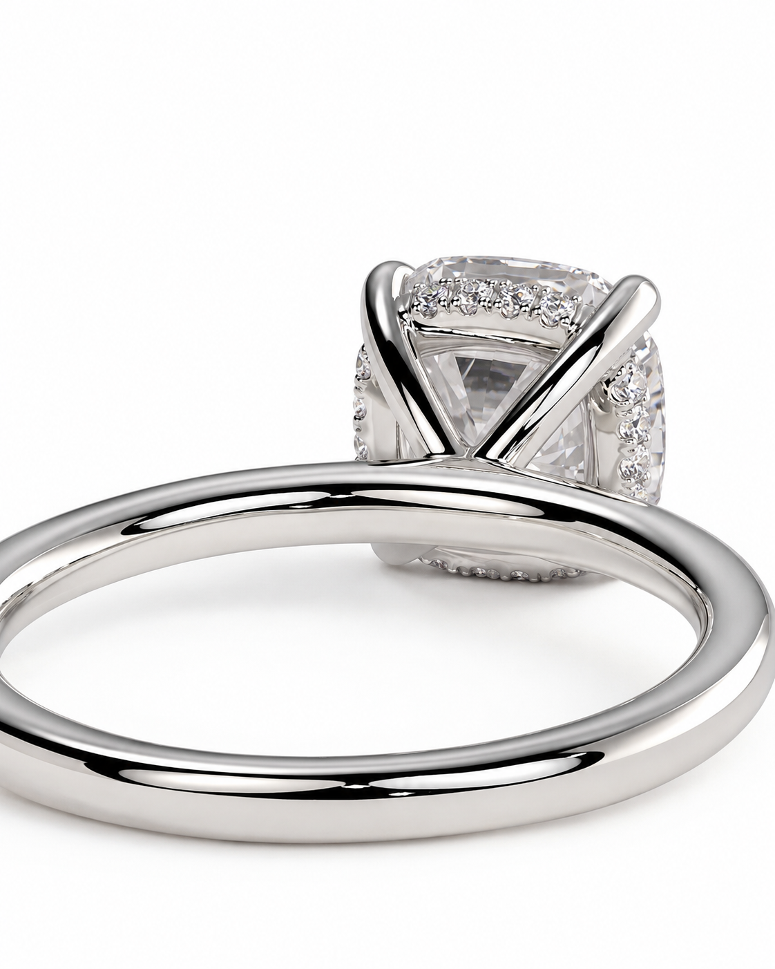 color_925_SIL,color_935_ARG,color_10K_WG, color_14K_WG &&A close-up studio shot of a silver-toned ring with a large clear gemstone in a square setting, accented by smaller stones, on a plain white background.