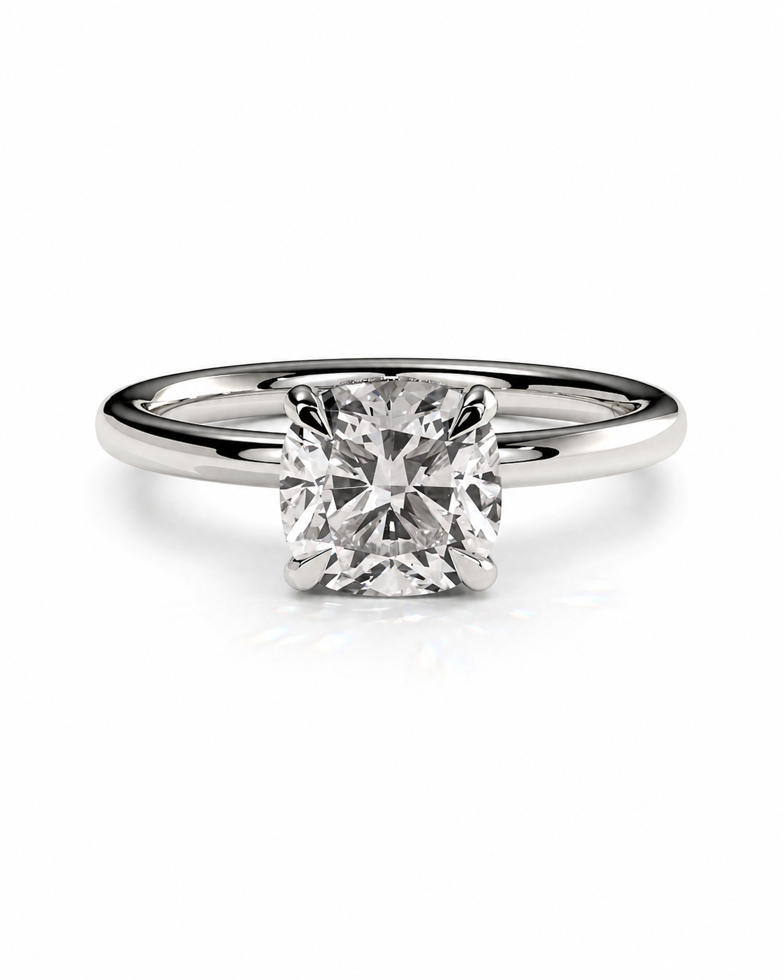color_925_SIL,color_935_ARG,color_10K_WG, color_14K_WG &&A radiant cut diamond solitaire ring set in a polished silver-colored band, shown on a clean white background with a soft reflection.