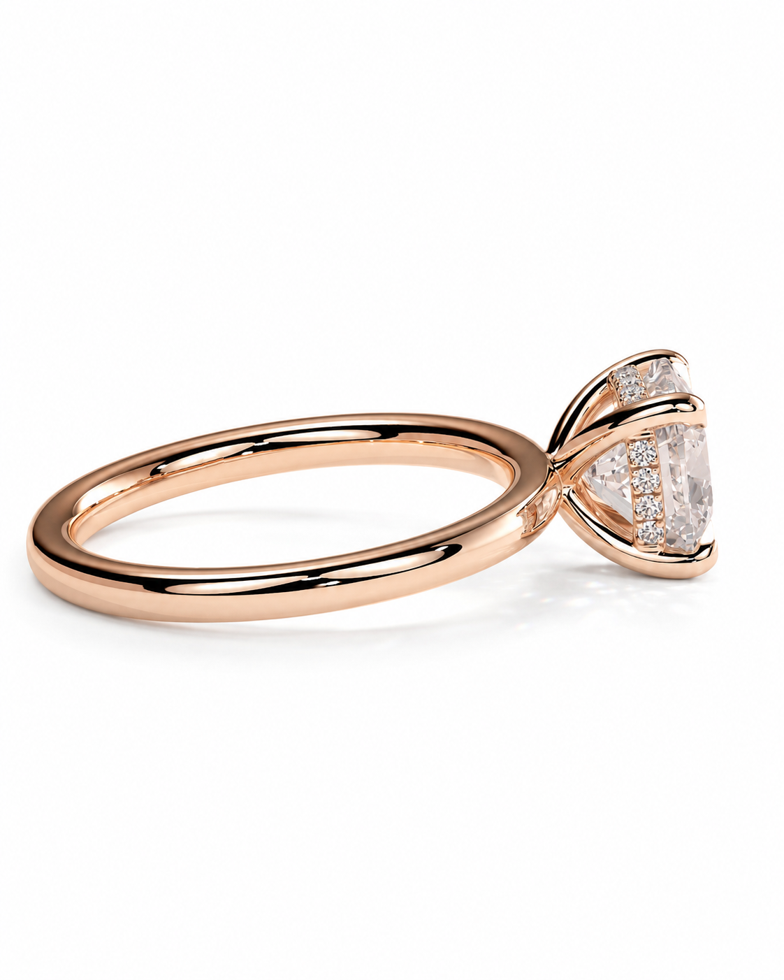 color_10K_RG, color_14K_RG &&A rose gold solitaire engagement ring with a marquise-cut center stone and a pavé band of small clear stones, shown on a clean white background.