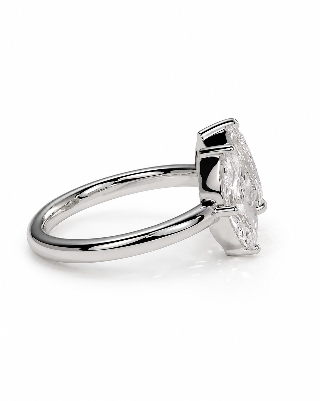 color_925_SIL,color_935_ARG,color_10K_WG, color_14K_WG &&A silver-toned ring featuring a marquise-cut clear gemstone in a prong setting, shown on a clean white background.