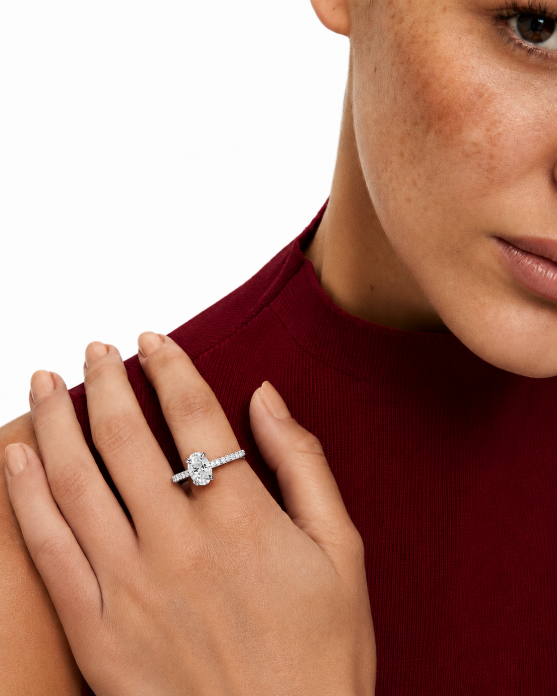 color_925_SIL,color_935_ARG,color_10K_WG, color_14K_WG &&A close-up lifestyle shot of a model wearing a silver engagement ring with a marquise-cut center stone and a pavé band, set against a clean white background.