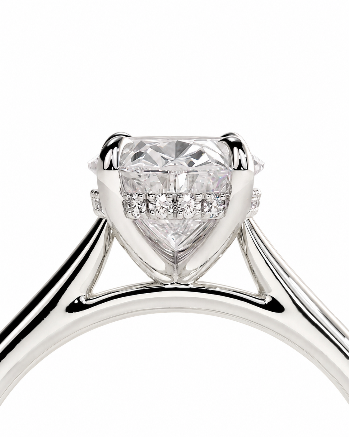 color_925_SIL,color_935_ARG,color_10K_WG, color_14K_WG &&A close-up studio shot of a silver-toned engagement ring featuring a large heart-shaped clear gemstone in a four-prong setting, with small accent diamonds along the band, on a plain white background.