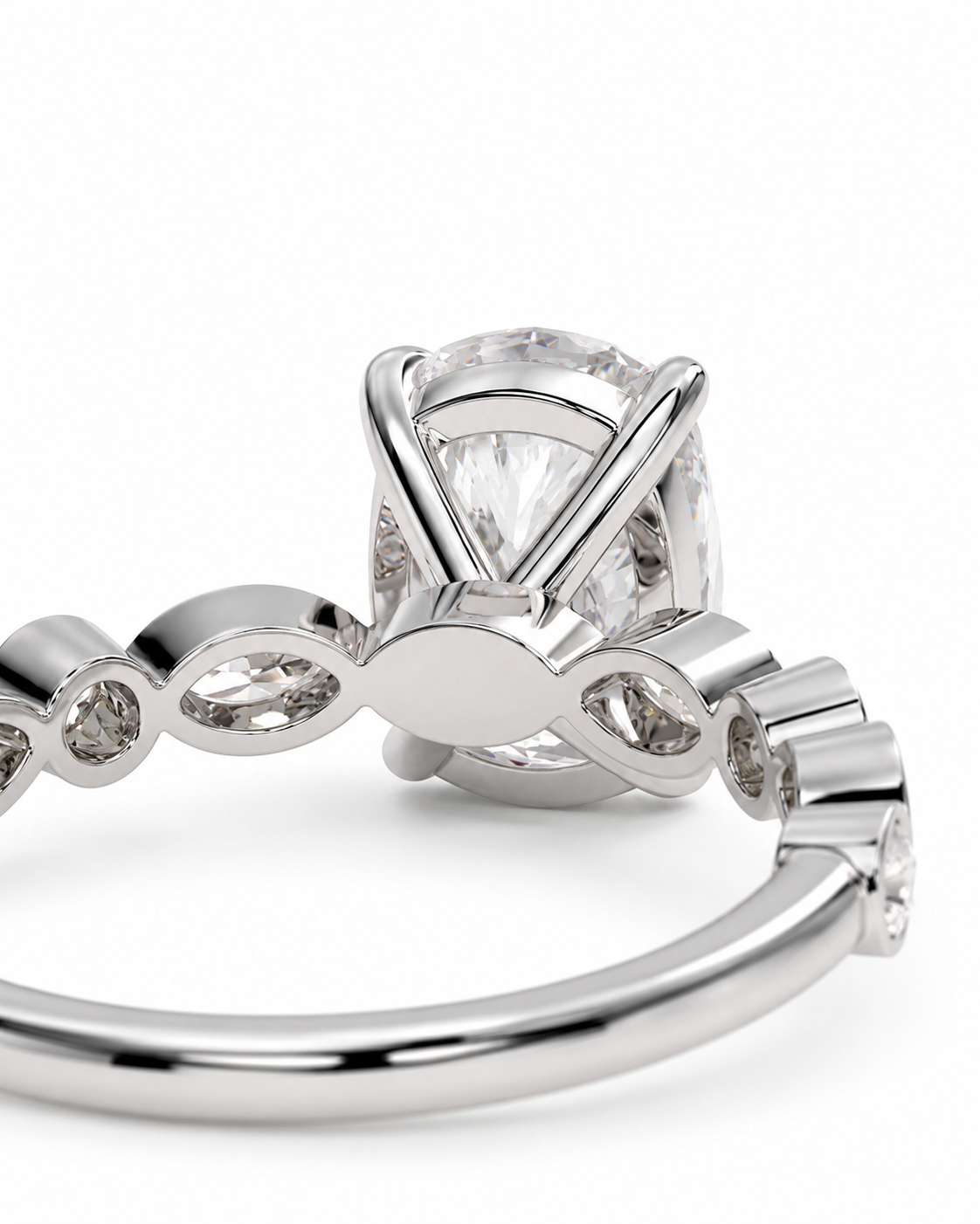 color_925_SIL,color_935_ARG,color_10K_WG, color_14K_WG &&
A close-up studio shot of a silver-toned ring featuring a large oval clear gemstone in a prong setting, with smaller marquise-shaped and round clear stones along the band, photographed on a white background.