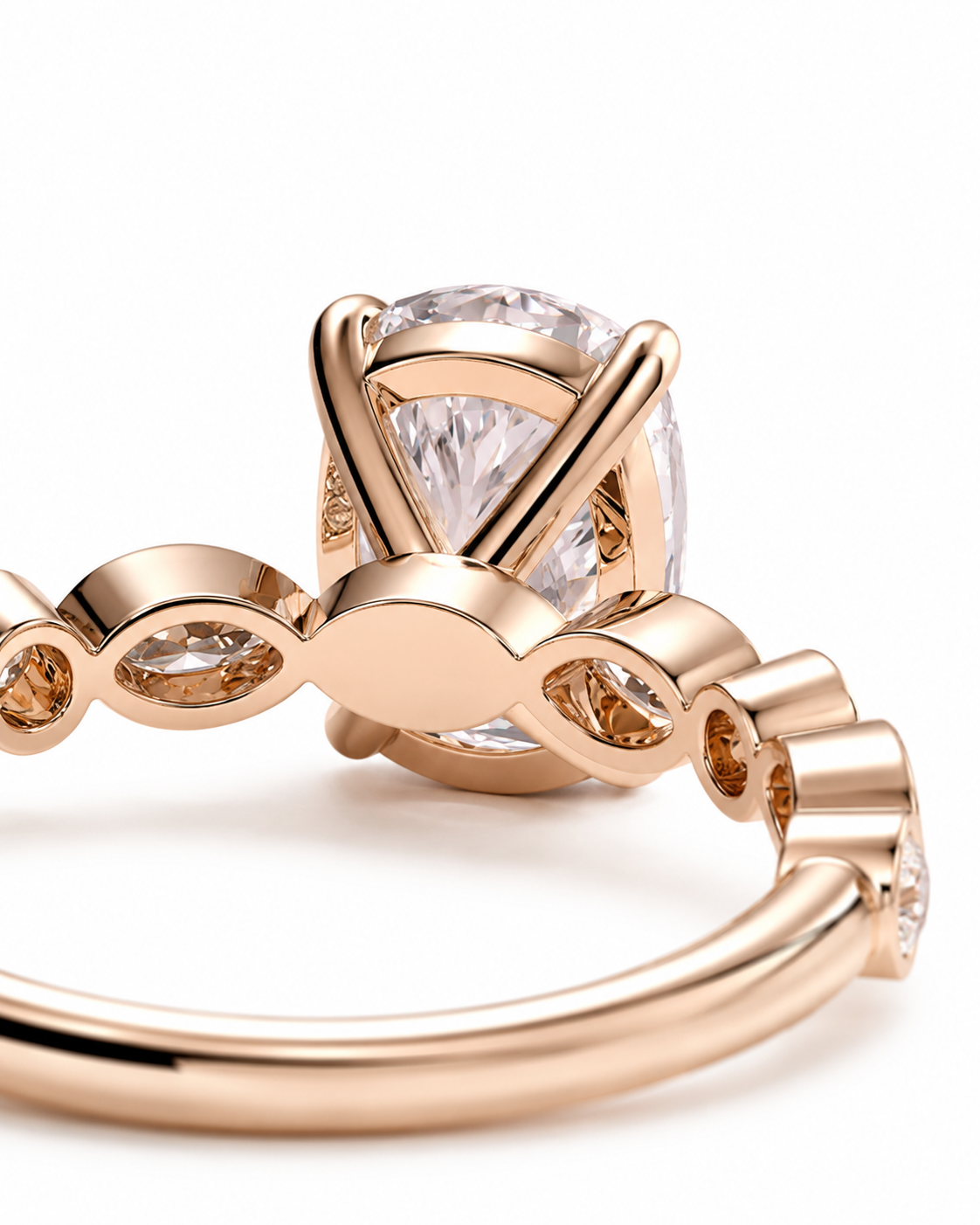 color_10K_RG, color_14K_RG &&
Rose gold ring with a large oval clear gemstone in a prong setting, featuring a decorative band with small inset stones, photographed on a white background.