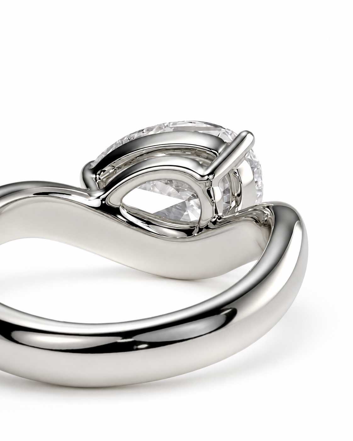 color_925_SIL,color_935_ARG,color_10K_WG, color_14K_WG &&A close-up studio shot of a silver-toned ring with a pear-cut clear center stone and a halo of small clear stones, photographed on a white background.