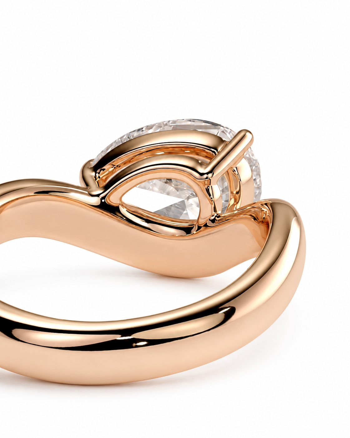 color_10K_RG, color_14K_RG &&A close-up of a rose gold ring featuring a pear-cut clear gemstone in a heart-shaped setting, with a smaller round diamond halo, on a white background.