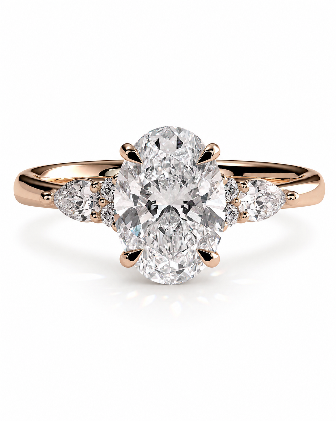 color_10K_RG, color_14K_RG &&An oval-cut diamond engagement ring with a rose gold band featuring smaller diamond side stones, set against a clean white background.