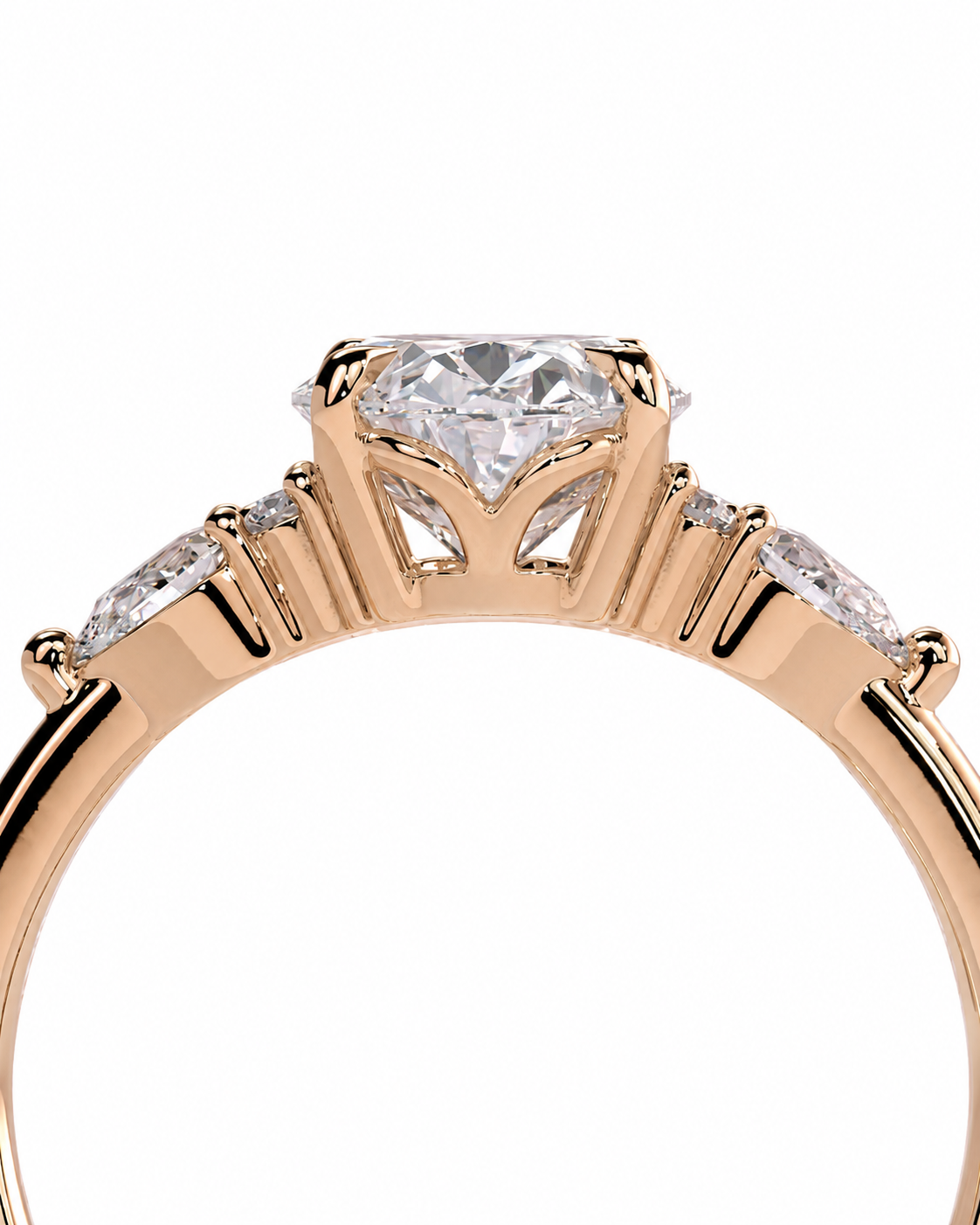 color_10K_RG, color_14K_RG &&A close-up of a rose gold ring featuring a large oval center stone and three marquise-cut side stones, set against a plain white background.