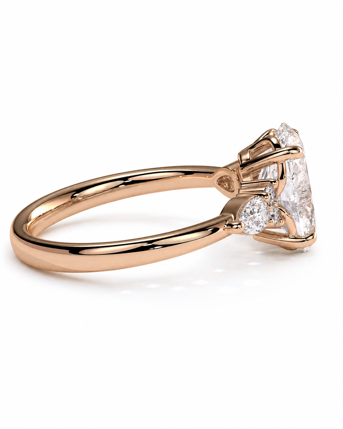 color_10K_RG, color_14K_RG &&A rose gold engagement ring featuring a large round brilliant-cut center stone and smaller round and heart-shaped accent stones, shown in a three-quarter side view on a clean white background.