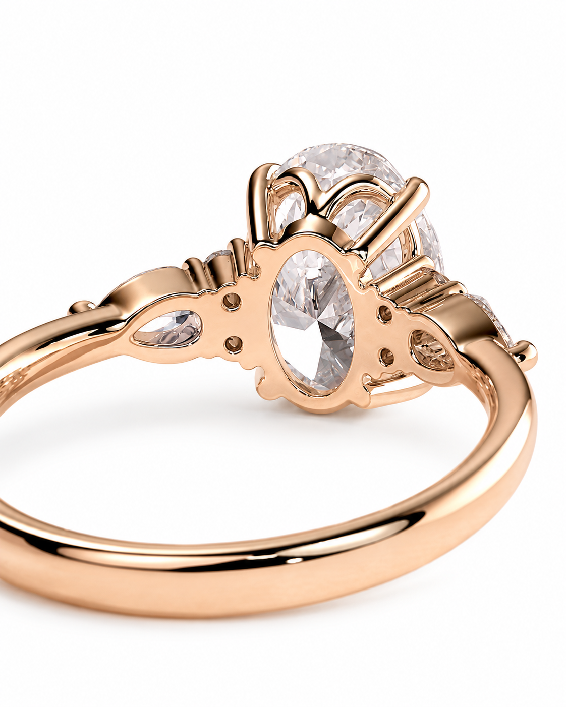 color_10K_RG, color_14K_RG &&Rose gold ring with a large oval clear gemstone and smaller accent stones, shown on a clean white background.