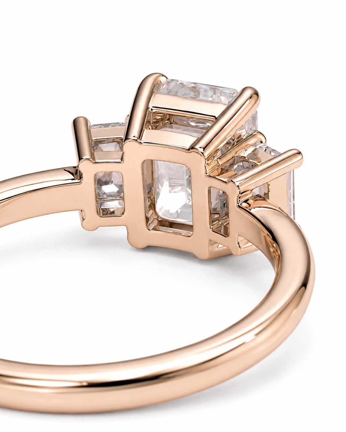 color_10K_RG, color_14K_RG &&Rose gold ring with rectangular clear gemstones in a box-like setting, photographed on a clean white background.