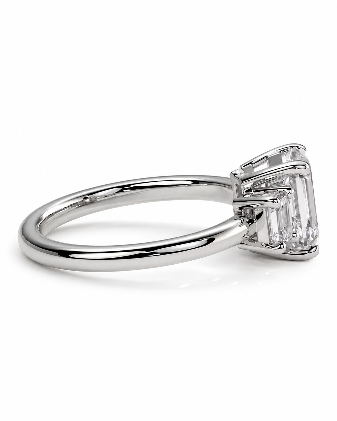 color_925_SIL,color_935_ARG,color_10K_WG, color_14K_WG &&A silver-toned engagement ring featuring a large emerald-cut clear gemstone in a four-prong setting, shown on a clean white background.