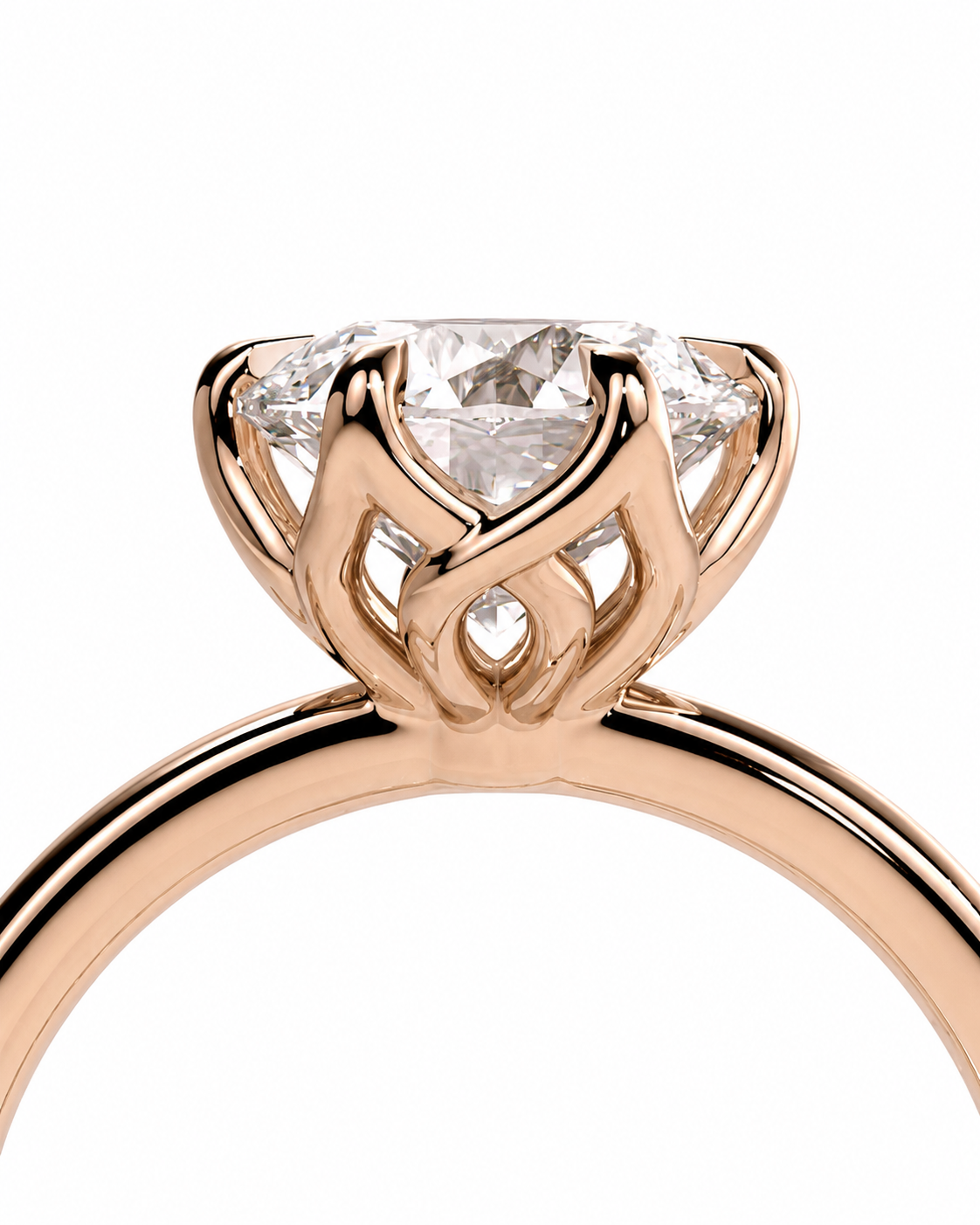 color_10K_RG, color_14K_RG &&Close-up of a rose gold solitaire engagement ring with a brilliant round-cut diamond in a decorative openwork crown setting, on a white background.