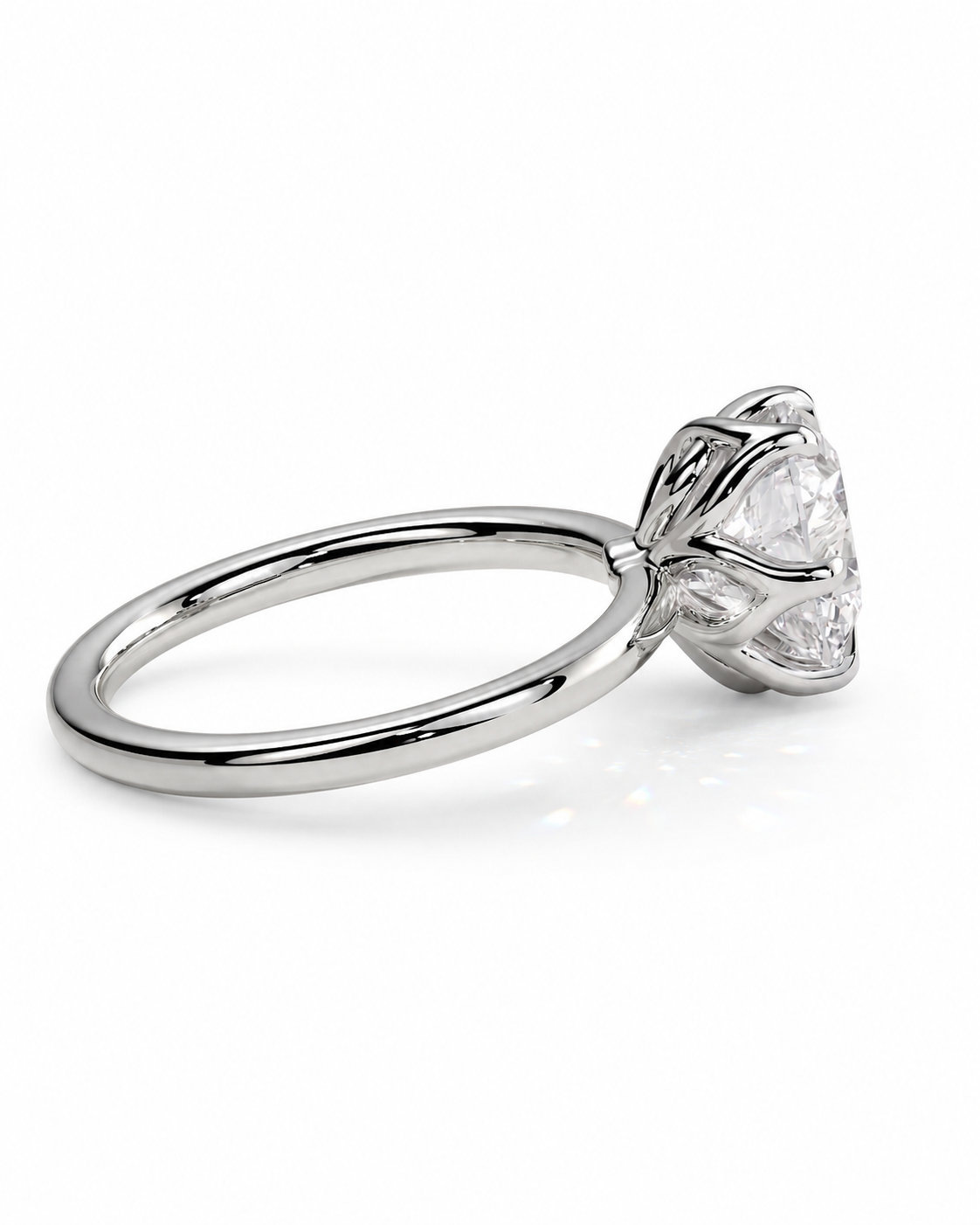 color_925_SIL,color_935_ARG,color_10K_WG, color_14K_WG &&A silver-toned solitaire engagement ring with a clear round-cut gemstone in a prong setting, shown on a clean white background.