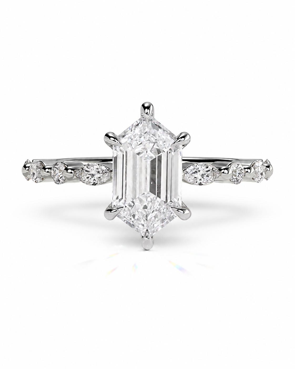 color_925_SIL,color_935_ARG,color_10K_WG, color_14K_WG &&An emerald-cut diamond engagement ring in a silver-toned metal setting, featuring a diamond band with small round diamonds, shot against a clean white background.