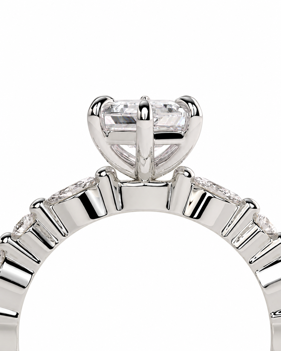color_925_SIL,color_935_ARG,color_10K_WG, color_14K_WG &&Close-up of a silver-toned ring with a large clear rectangular gemstone in a four-prong setting, with smaller clear stones along the band, on a white background.