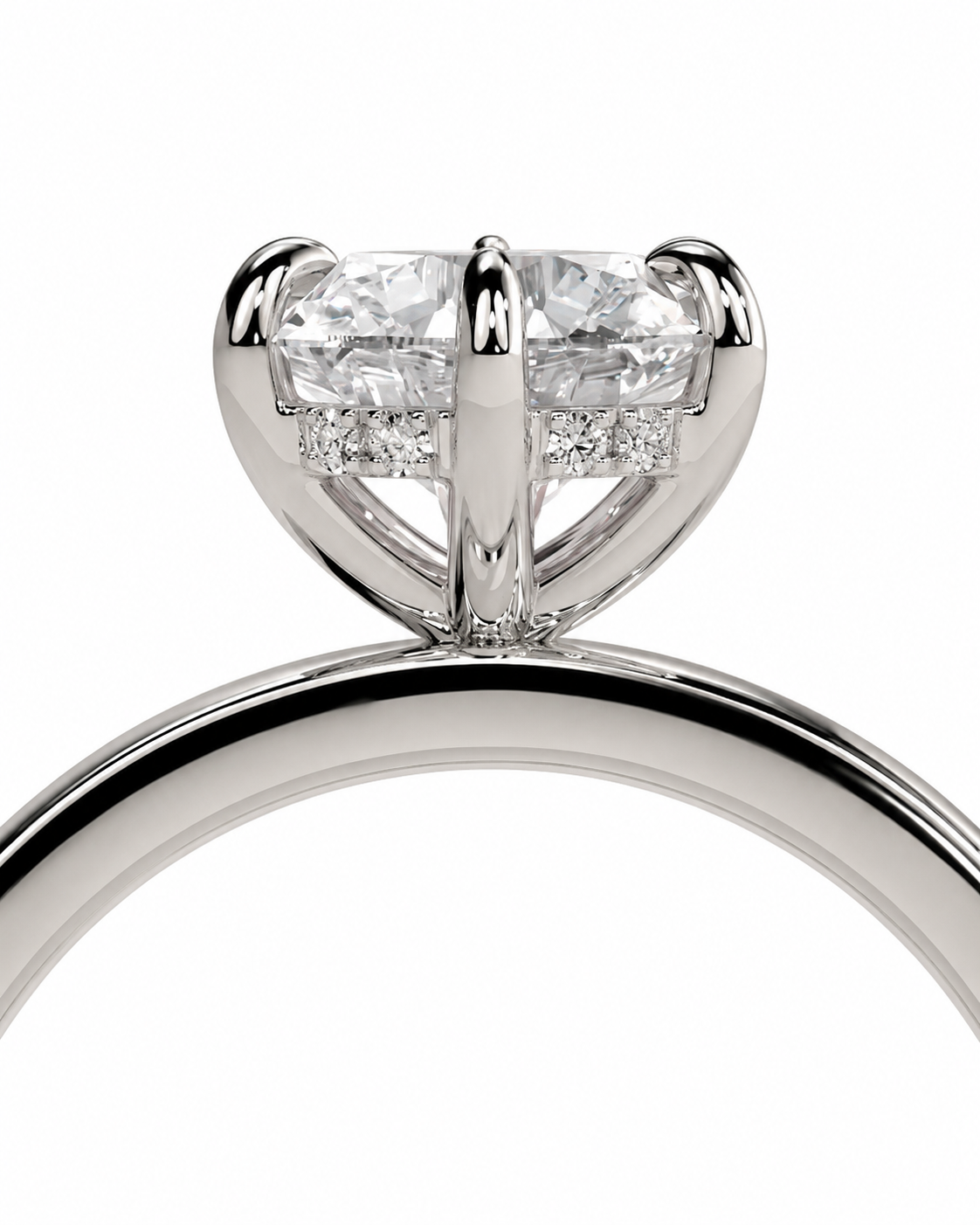 color_925_SIL,color_935_ARG,color_10K_WG, color_14K_WG &&Close-up of a silver-toned ring with a large heart-shaped clear gemstone in a prong setting, with small accent stones along the band, on a white background.