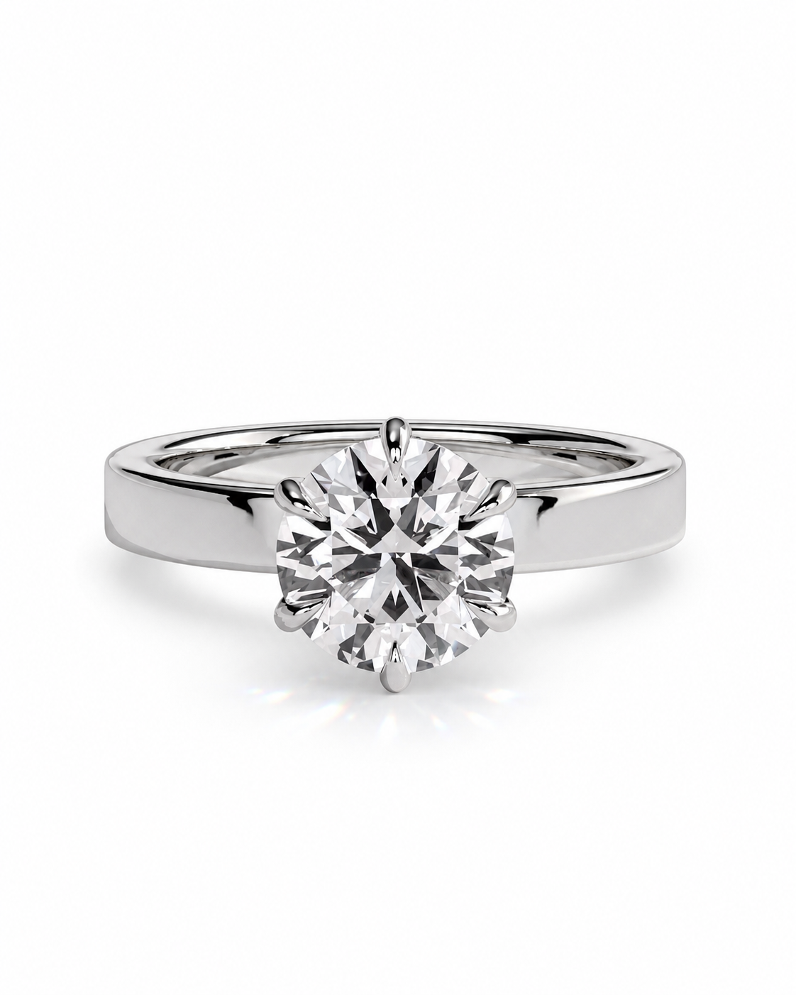 color_925_SIL,color_935_ARG,color_10K_WG, color_14K_WG &&A classic solitaire engagement ring featuring a round brilliant-cut diamond set in a polished white gold or platinum band, shown on a clean white background.