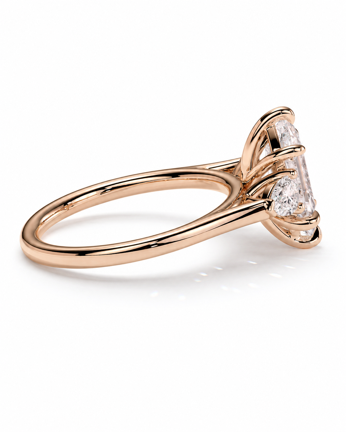 color_10K_RG, color_14K_RG &&A rose gold diamond ring with a marquise-cut center stone and smaller diamonds along the shoulders, shown on a clean white background.
