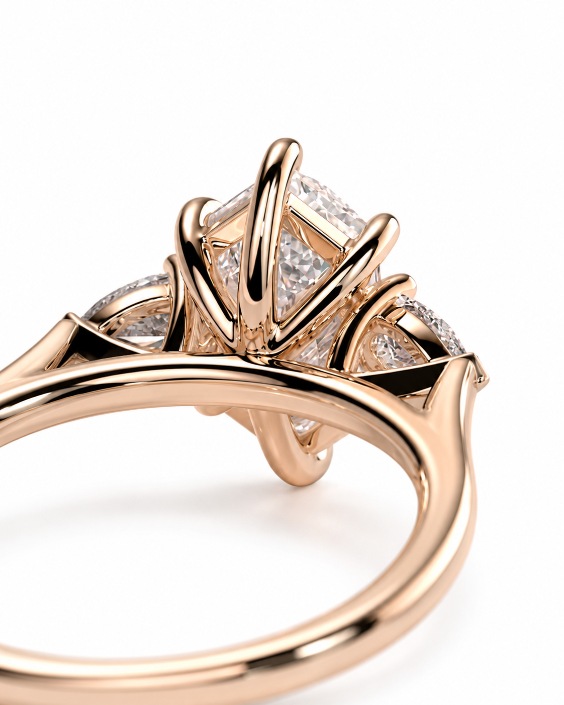 color_10K_RG, color_14K_RG &&A close-up of a rose gold ring featuring a multi-stone cluster setting with clear gemstones on a white background.