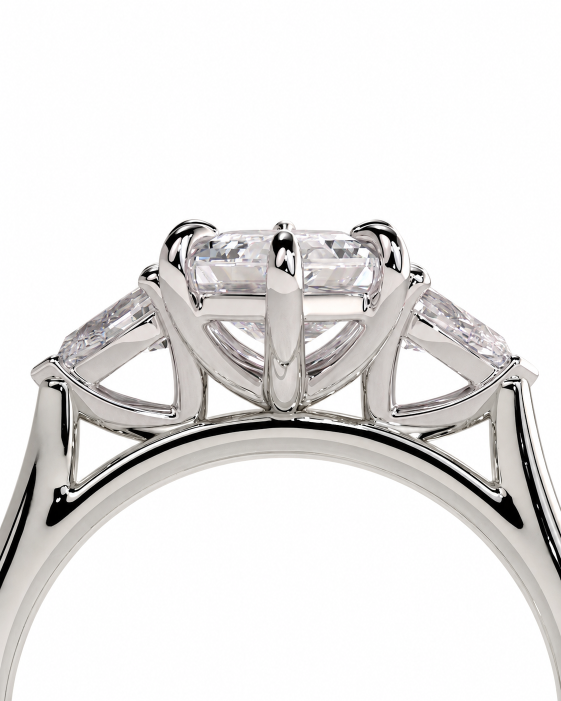 color_925_SIL,color_935_ARG,color_10K_WG, color_14K_WG &&A close-up studio shot of a silver-toned ring featuring a large oval clear gemstone in a prong setting, with three smaller marquise-cut side stones, on a plain white background.
