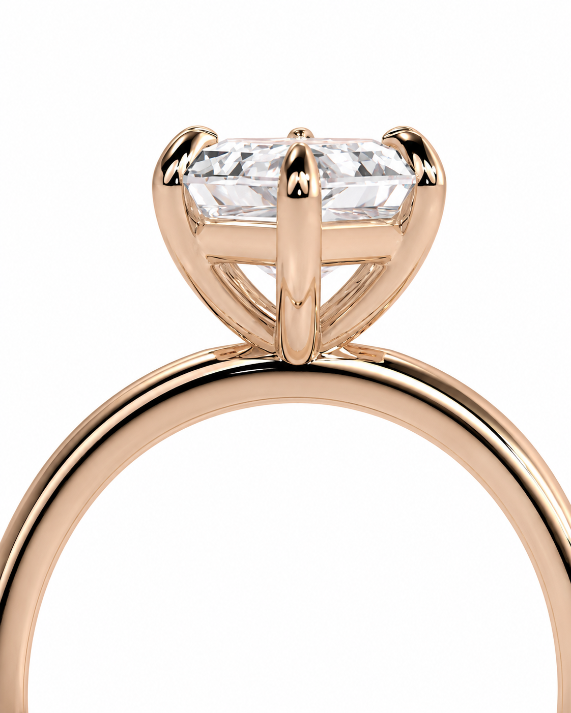 color_10K_RG, color_14K_RG &&
Rose gold solitaire engagement ring with a large oval-cut clear gemstone in a four-prong setting, shown on a plain white background.