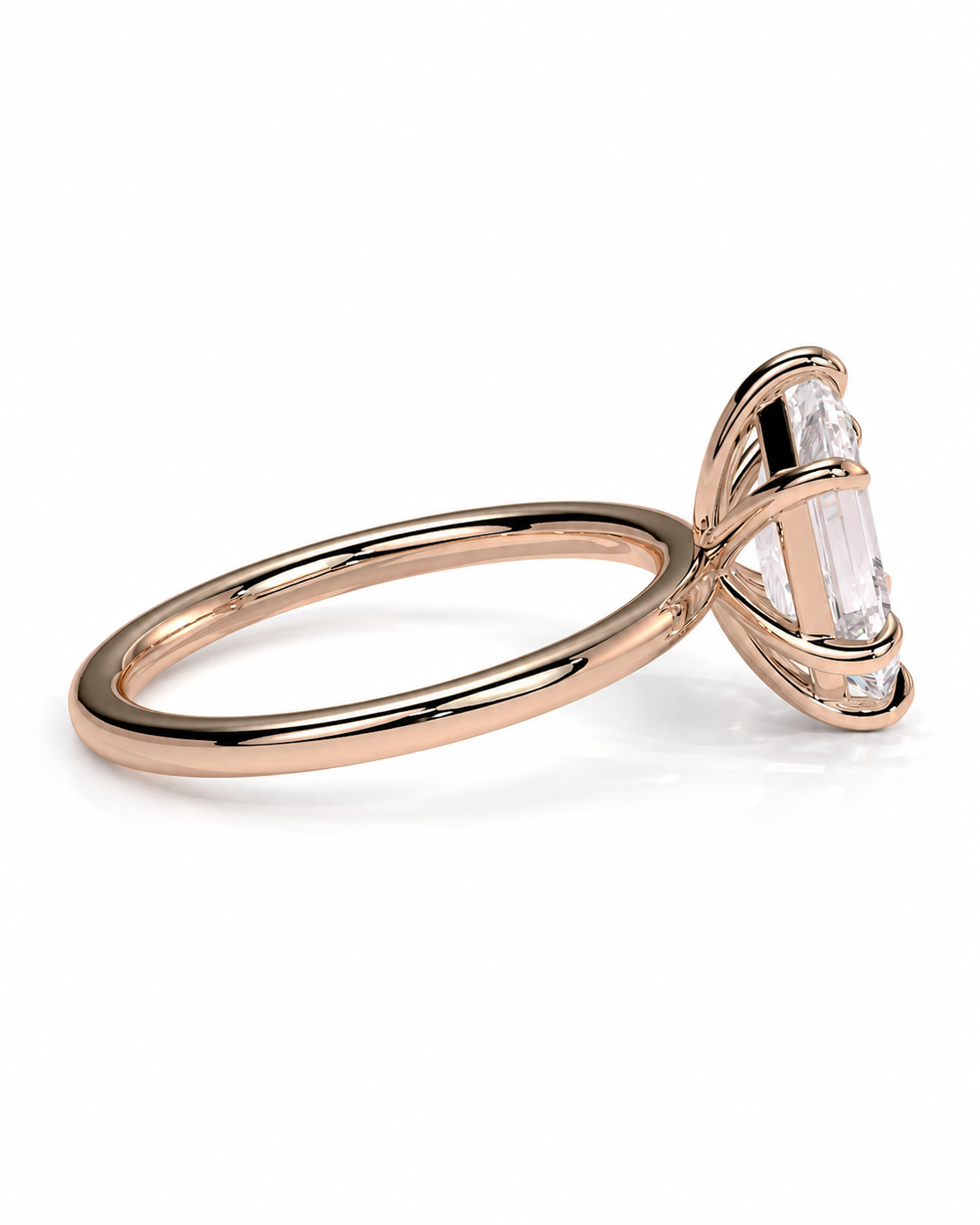 color_10K_RG, color_14K_RG &&
A rose gold ring with a large clear baguette-cut center stone and smaller accent stones, shown on a clean white background.