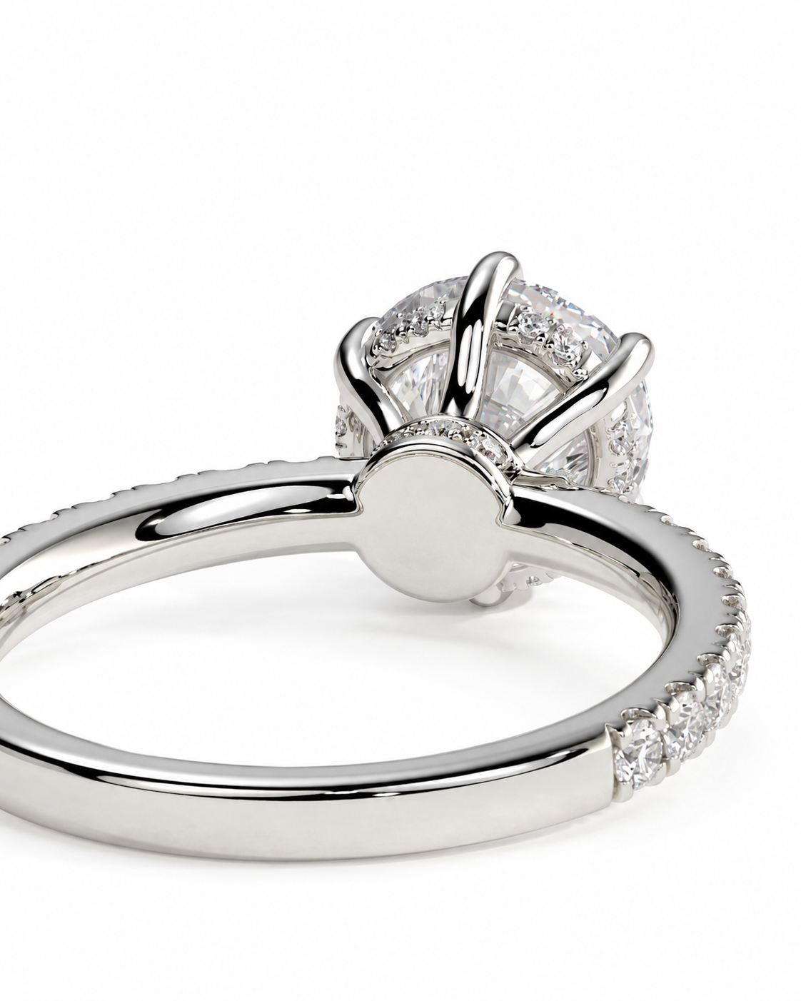 color_925_SIL,color_935_ARG,color_10K_WG, color_14K_WG &&Close-up of a silver-tone ring with a round clear gemstone in a prong setting, with small pavé accents along the band, on a white background.