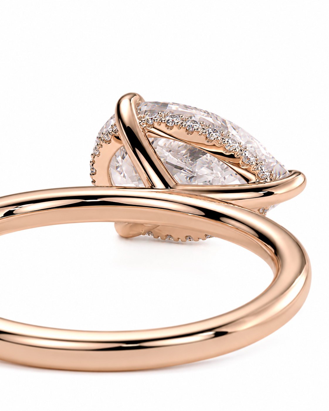 color_10K_RG, color_14K_RG &&Rose gold ring with a marquise-cut clear gemstone and small accent diamonds, shown on a clean white background.