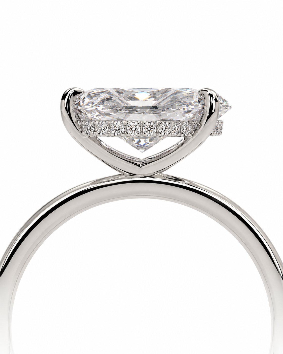 color_925_SIL,color_935_ARG,color_10K_WG, color_14K_WG &&A close-up studio shot of a silver-toned diamond ring featuring a marquise-cut center stone and a halo of small pavé-set diamonds on a clean white background.